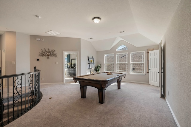 game room featuring light carpet, a textured ceiling, vaulted ceiling, and pool table