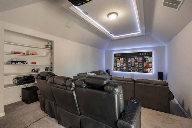 cinema room featuring lofted ceiling and light carpet