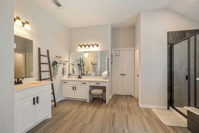 bathroom featuring a shower with door, vanity, and high vaulted ceiling