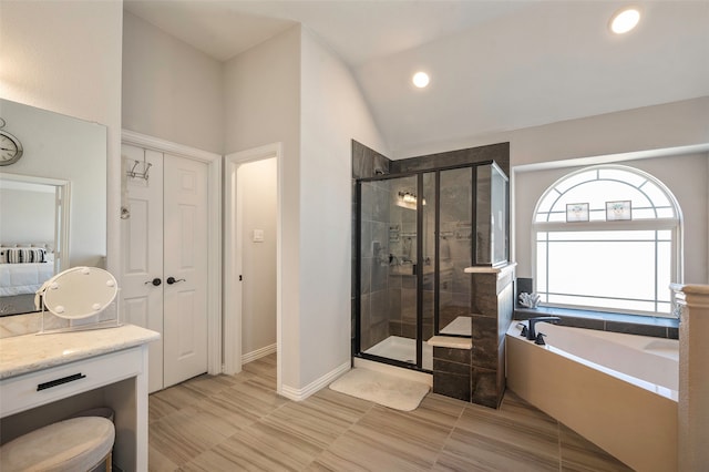 bathroom with vanity, plus walk in shower, and lofted ceiling