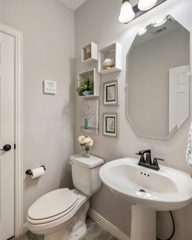 bathroom with toilet and sink