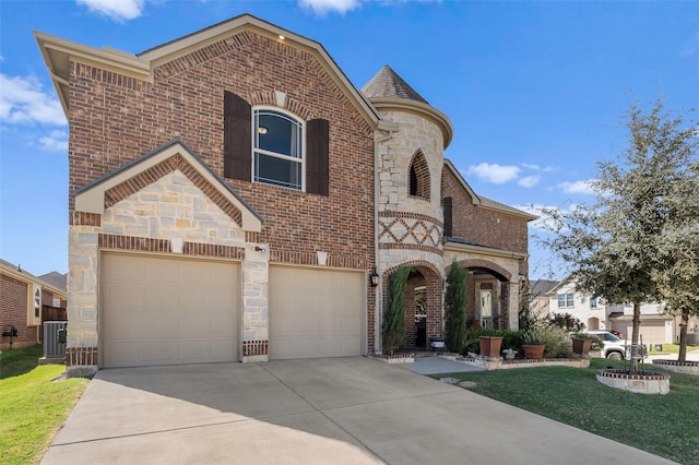 view of front of home with a front yard, central AC, and a garage