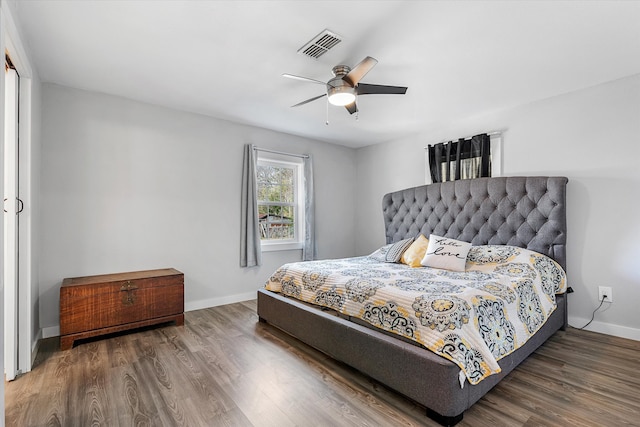 bedroom featuring dark wood-type flooring and ceiling fan