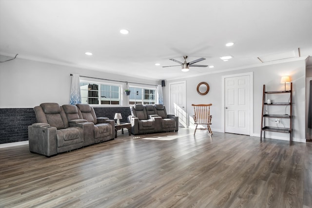 living room with ornamental molding, dark hardwood / wood-style floors, and ceiling fan