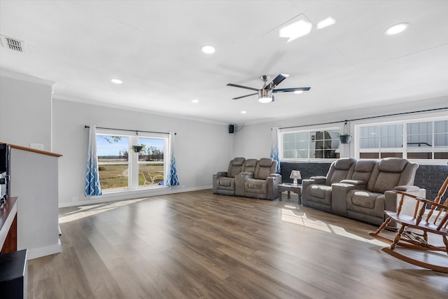 living room featuring crown molding, hardwood / wood-style floors, and ceiling fan