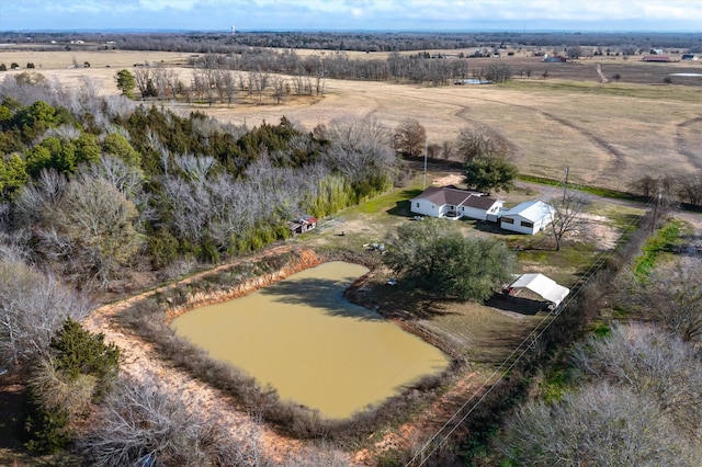 birds eye view of property with a water view and a rural view