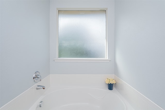 bathroom with a tub to relax in