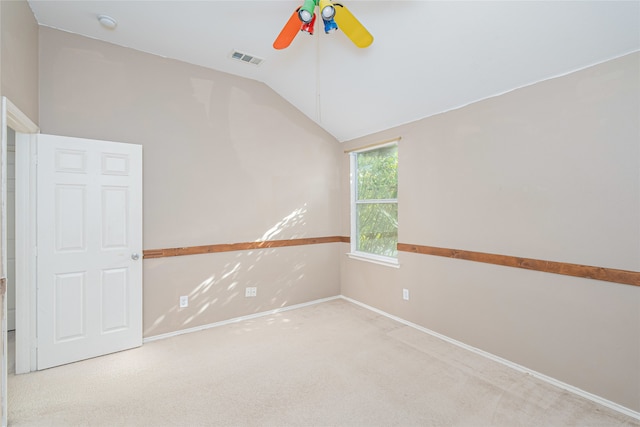 unfurnished room featuring light colored carpet, ceiling fan, and lofted ceiling