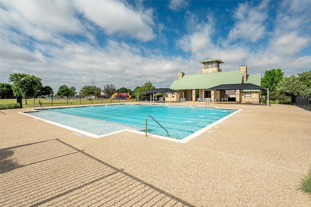 view of swimming pool with a gazebo and a patio