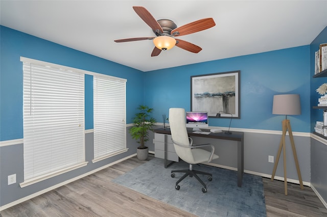 home office featuring hardwood / wood-style flooring and ceiling fan