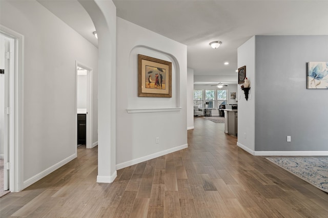 corridor with light wood-type flooring