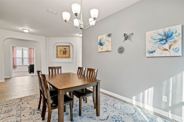 dining space featuring a chandelier