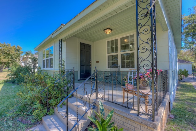 property entrance featuring covered porch