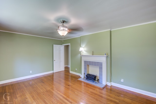 unfurnished living room featuring crown molding, wood-type flooring, and ceiling fan