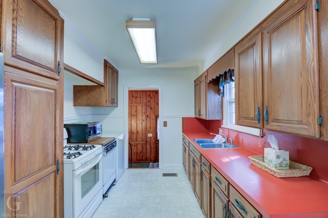 kitchen with sink and white appliances