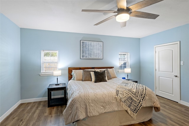 bedroom featuring ceiling fan and dark hardwood / wood-style floors