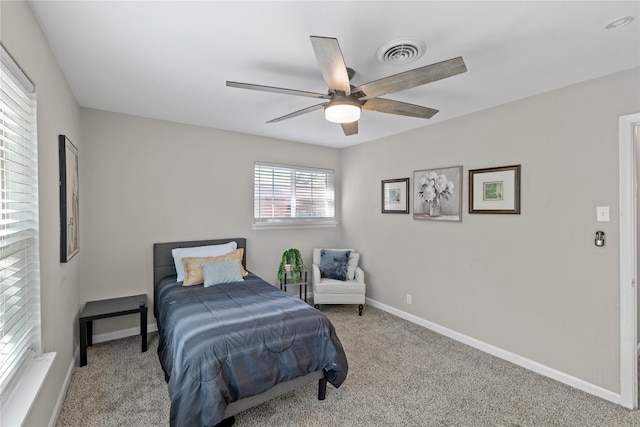 bedroom featuring ceiling fan and light colored carpet