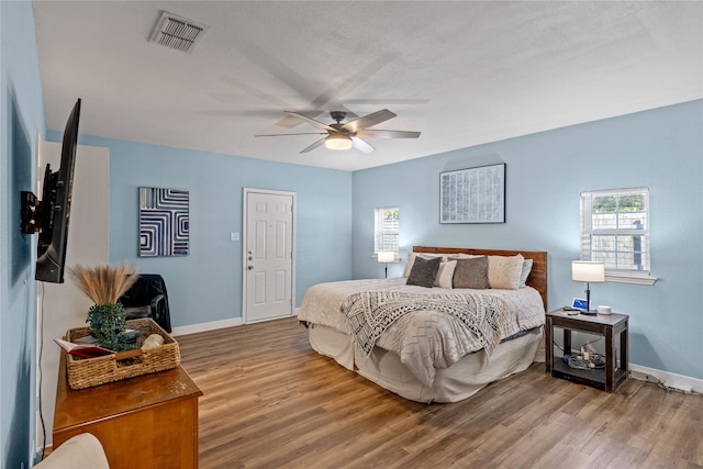 bedroom featuring ceiling fan and wood-type flooring