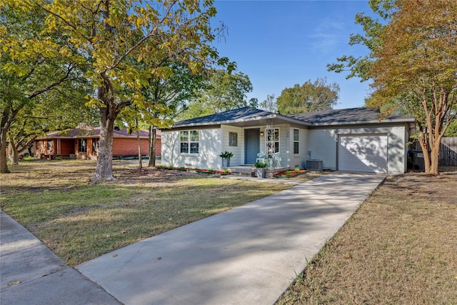 single story home featuring covered porch, a garage, a front yard, and central AC