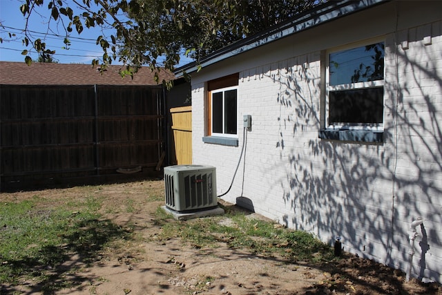 view of side of property featuring cooling unit