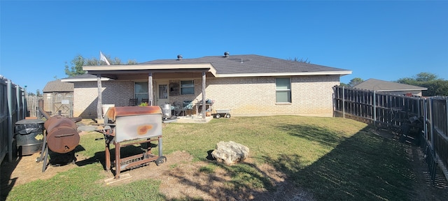 rear view of house with a lawn