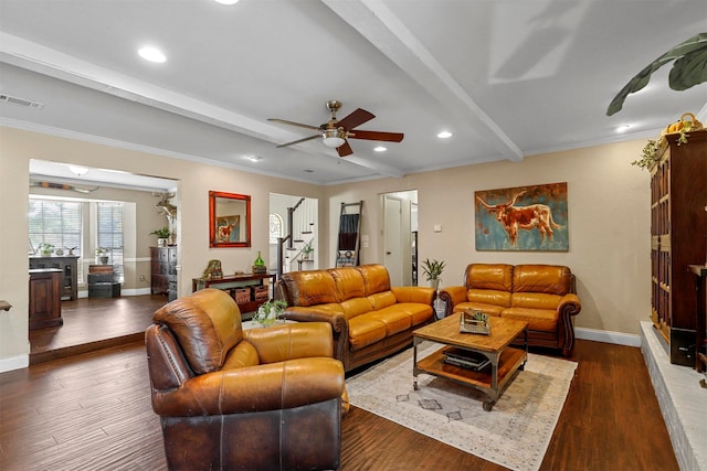 living room featuring beamed ceiling, ceiling fan, ornamental molding, and dark wood-type flooring