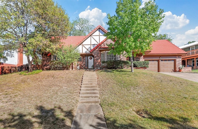 view of front of home featuring a garage and a front yard