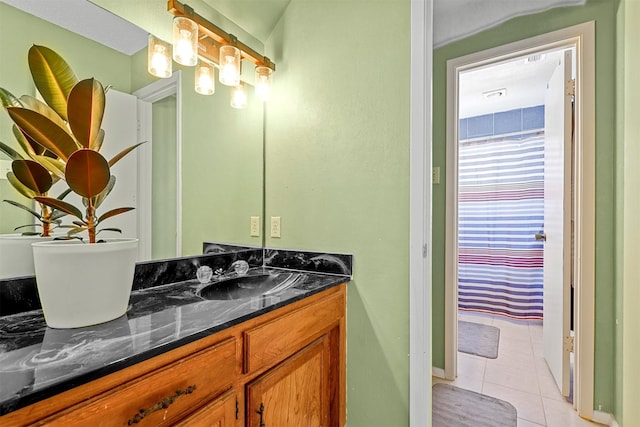 bathroom featuring tile patterned floors and vanity