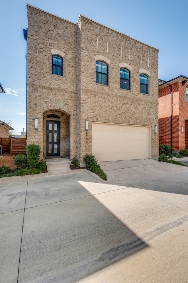 view of front of home featuring french doors and a garage