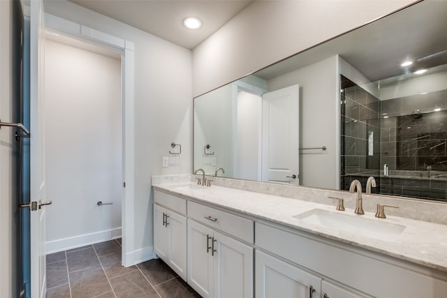 bathroom with a shower with door and vanity