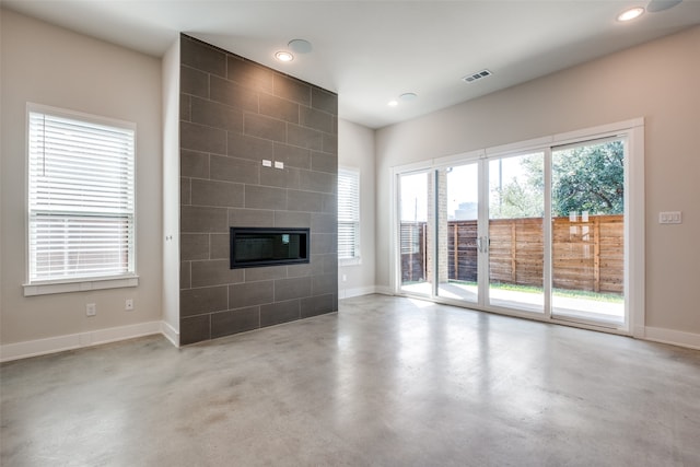 unfurnished living room featuring a fireplace