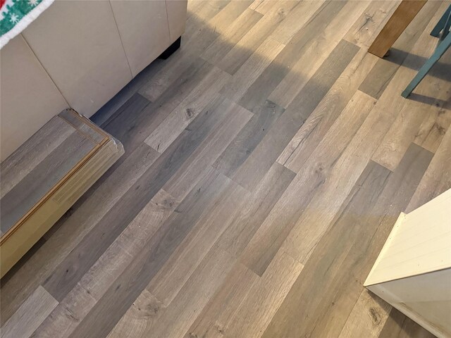 dining area featuring dark wood-type flooring and a wealth of natural light