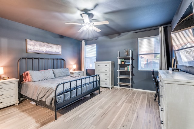 bedroom featuring light hardwood / wood-style flooring and ceiling fan