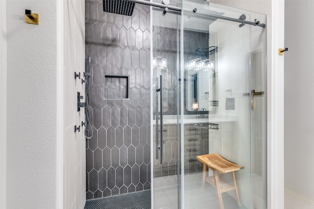 bathroom featuring a shower with shower door