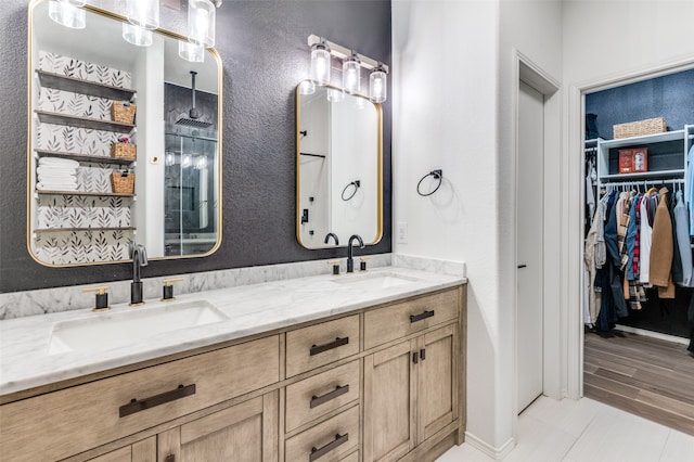 bathroom with vanity, a shower, and wood-type flooring