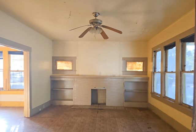 unfurnished living room featuring ceiling fan