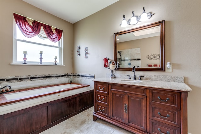 bathroom featuring vanity, tile patterned flooring, and plus walk in shower