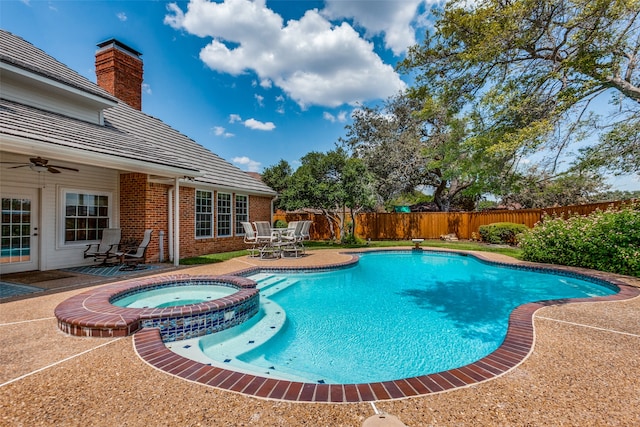 view of pool featuring an in ground hot tub and a patio area