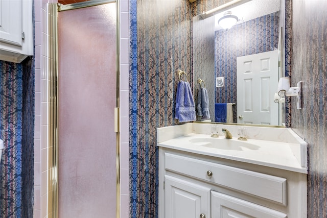 bathroom with vanity and an enclosed shower