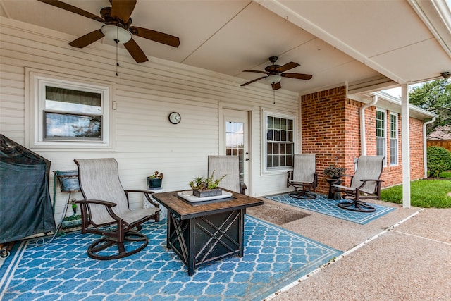 view of patio with an outdoor fire pit and ceiling fan