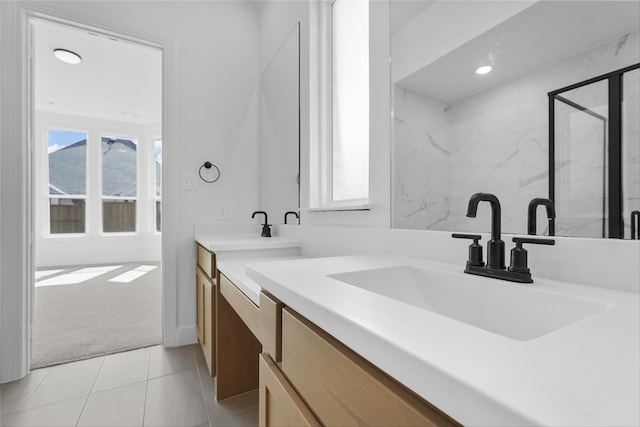 full bathroom featuring tile patterned flooring, a marble finish shower, vanity, and recessed lighting