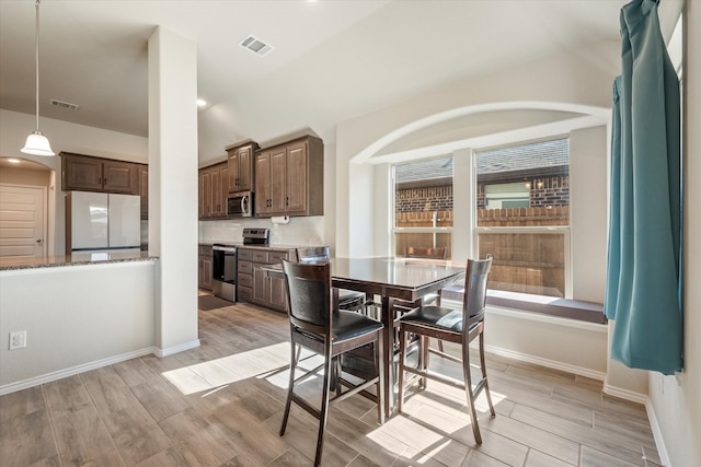 dining space featuring light hardwood / wood-style flooring