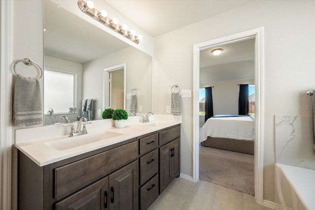 bathroom featuring tile patterned flooring and vanity