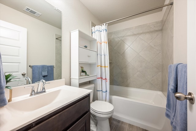 full bathroom with shower / bath combination with curtain, vanity, hardwood / wood-style flooring, and toilet