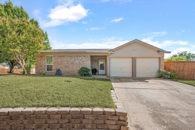 single story home with a front yard and a garage