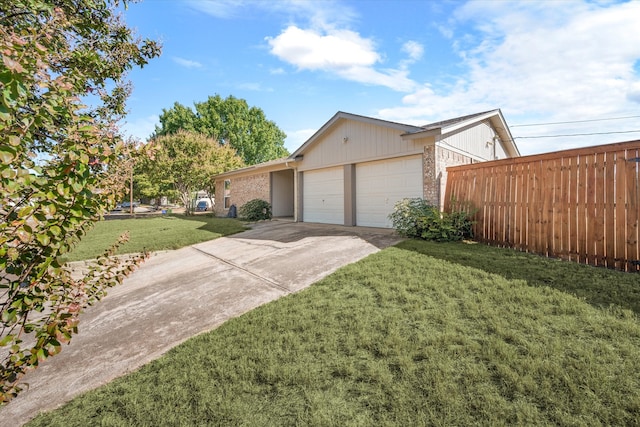 exterior space featuring a front lawn and a garage