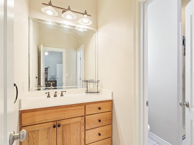 bathroom featuring vanity and toilet