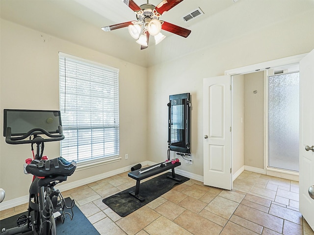 workout area featuring ceiling fan and a healthy amount of sunlight