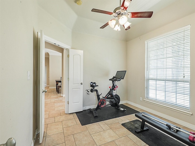 exercise area featuring plenty of natural light, lofted ceiling, and ceiling fan