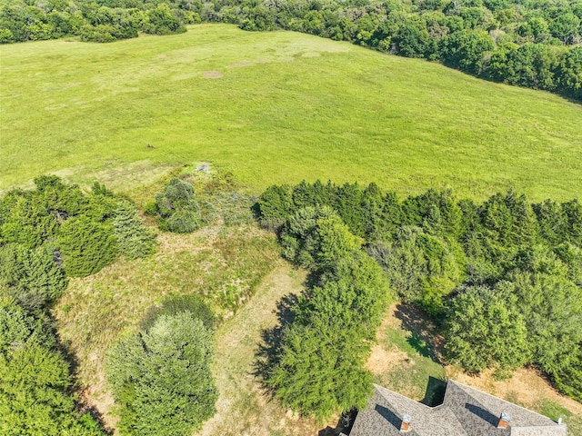 birds eye view of property with a rural view